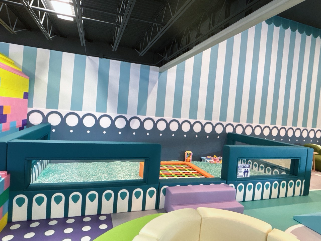 Trampoline and play zone with playful striped decor